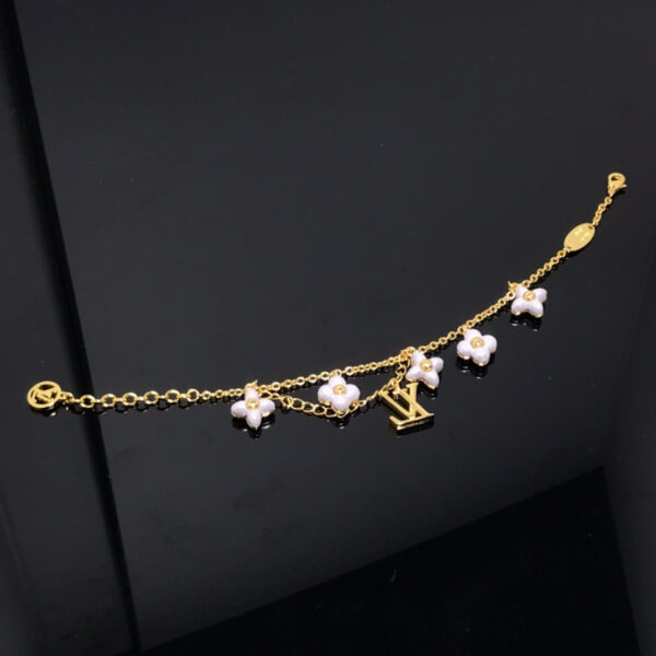 Toxse  Logo 6 Motif Star And Sun Gold Bracelet - Image 4